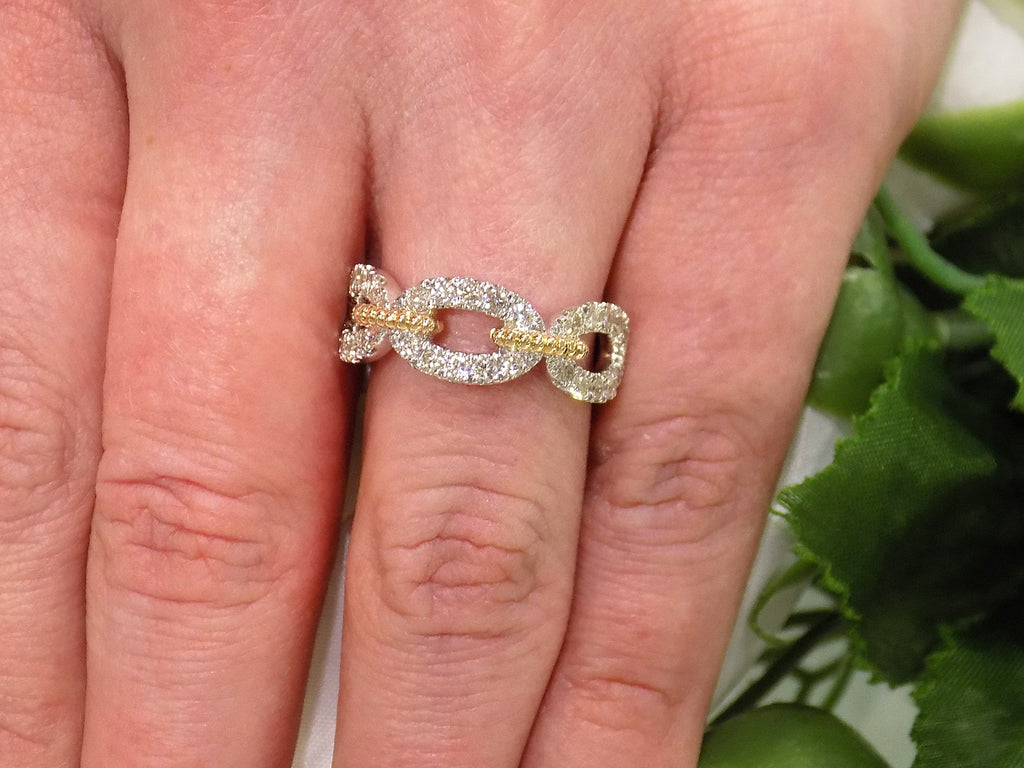 1.50ct natural diamond two tone white and yellow gold band on a ladies finger.
