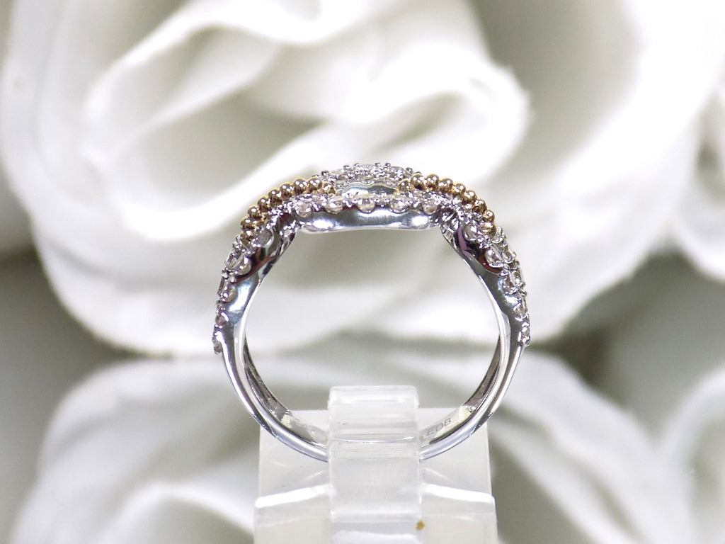 1.50ct natural diamond two tone white and yellow gold band from a side view.