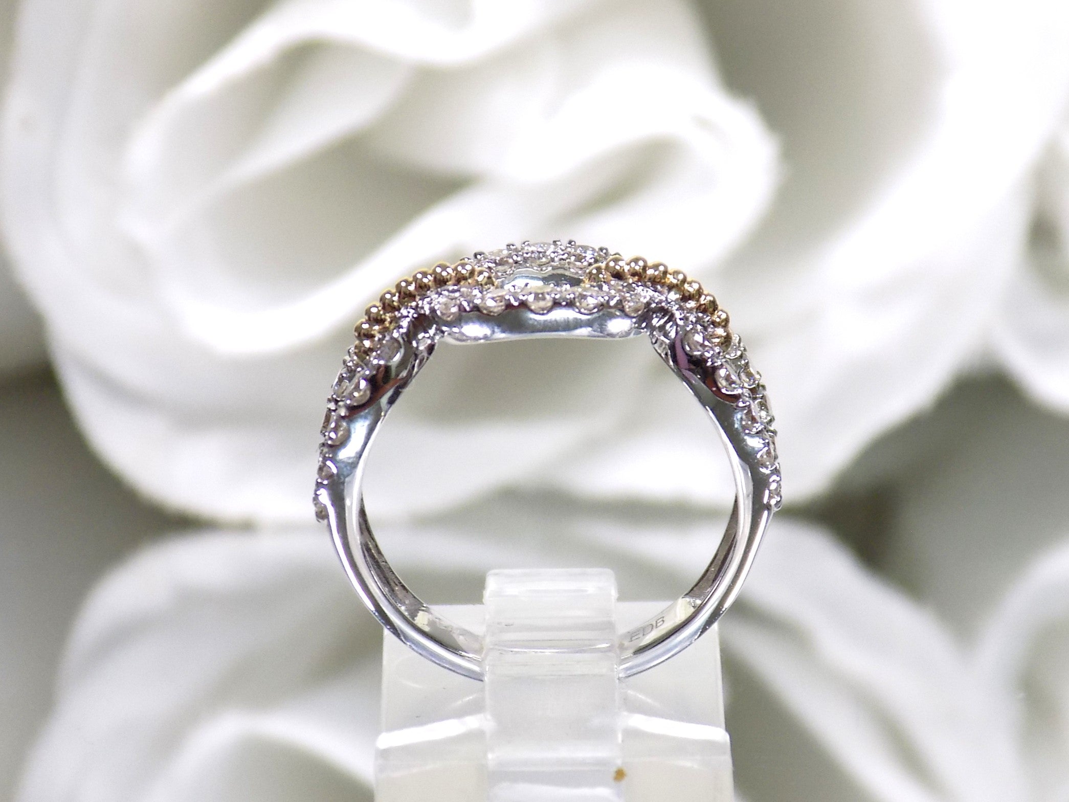 1.50ct natural diamond two tone white and yellow gold band from a side view.