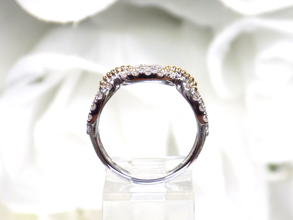 1.50ct natural diamond two tone white and yellow gold band from a side view.