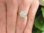 Estate 1.00ct total weight 7 stone round natural diamond cluster in 14K Yellow and White Gold on a ladies finger.
