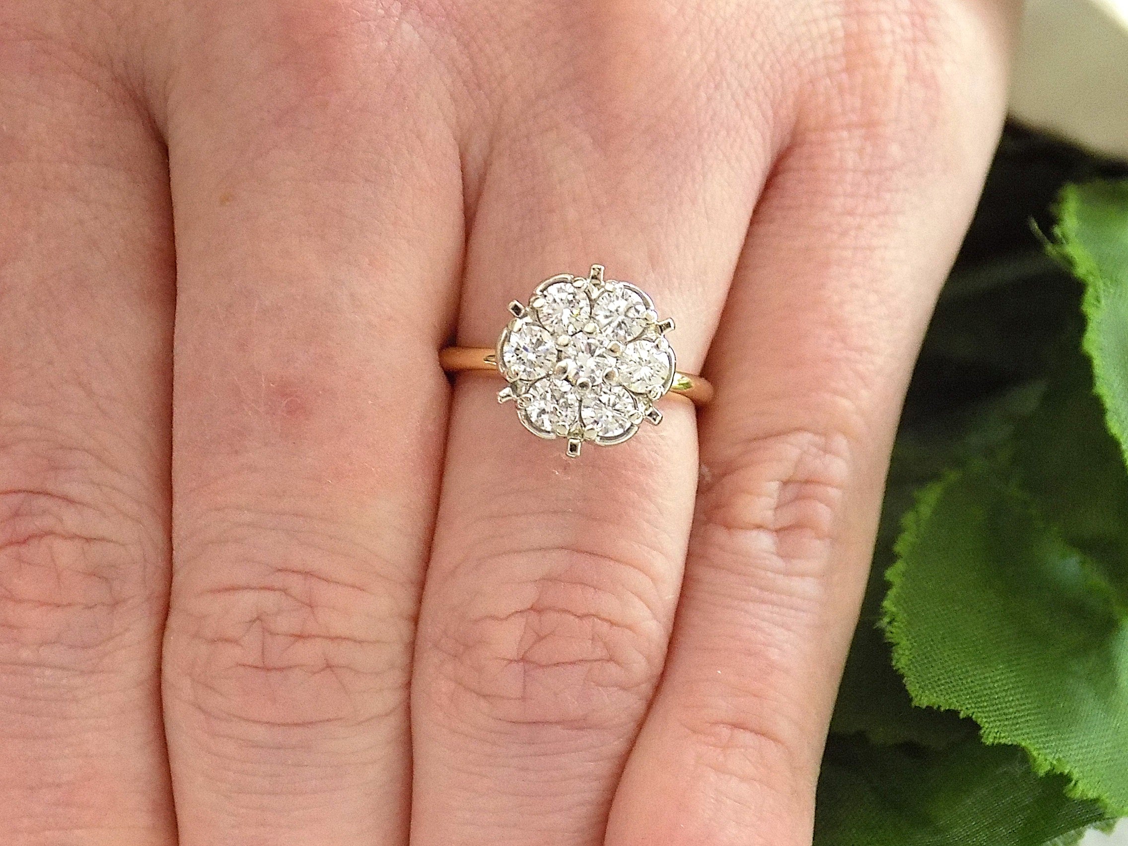 Estate 1.00ct total weight 7 stone round natural diamond cluster in 14K Yellow and White Gold on a ladies finger.