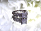 This is an Estate ring with 1.00ct total weight invisible set diamond ring with natural princess cut and round diamonds in white gold.