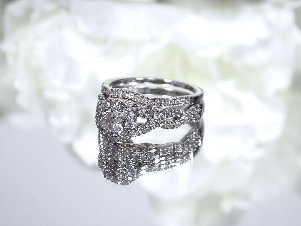 This is a women's 2-piece wedding set which includes the engagement ring and matching band weighing 1.02ct in natural diamonds in white gold with rose gold accents on a mirrored white background