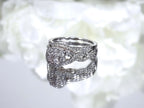 This is a women's 2-piece wedding set which includes the engagement ring and matching band weighing 1.02ct in natural diamonds in white gold with rose gold accents on a mirrored white background