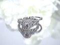 This is a women's 2-piece wedding set which includes the engagement ring and matching band weighing 1.02ct in natural diamonds in white gold with rose gold accents on a mirrored white background