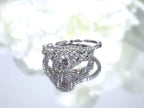 This is a women's 2-piece wedding set which includes the engagement ring and matching band weighing 1.02ct in natural diamonds in white gold with rose gold accents on a mirrored white background