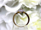 .50ct total weight with chocolate marquise center diamond and white round diamond accents in 2-tone white and yellow gold. Side view.