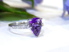 This is a 2.00ct natural amethyst and .06ct diamond ring in 14K white gold with a white and green background.