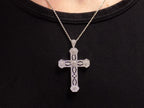 This is a .50ct natural diamond cross pendant with a very Victorian look in 10K white gold on a ladies neck with black shirt.