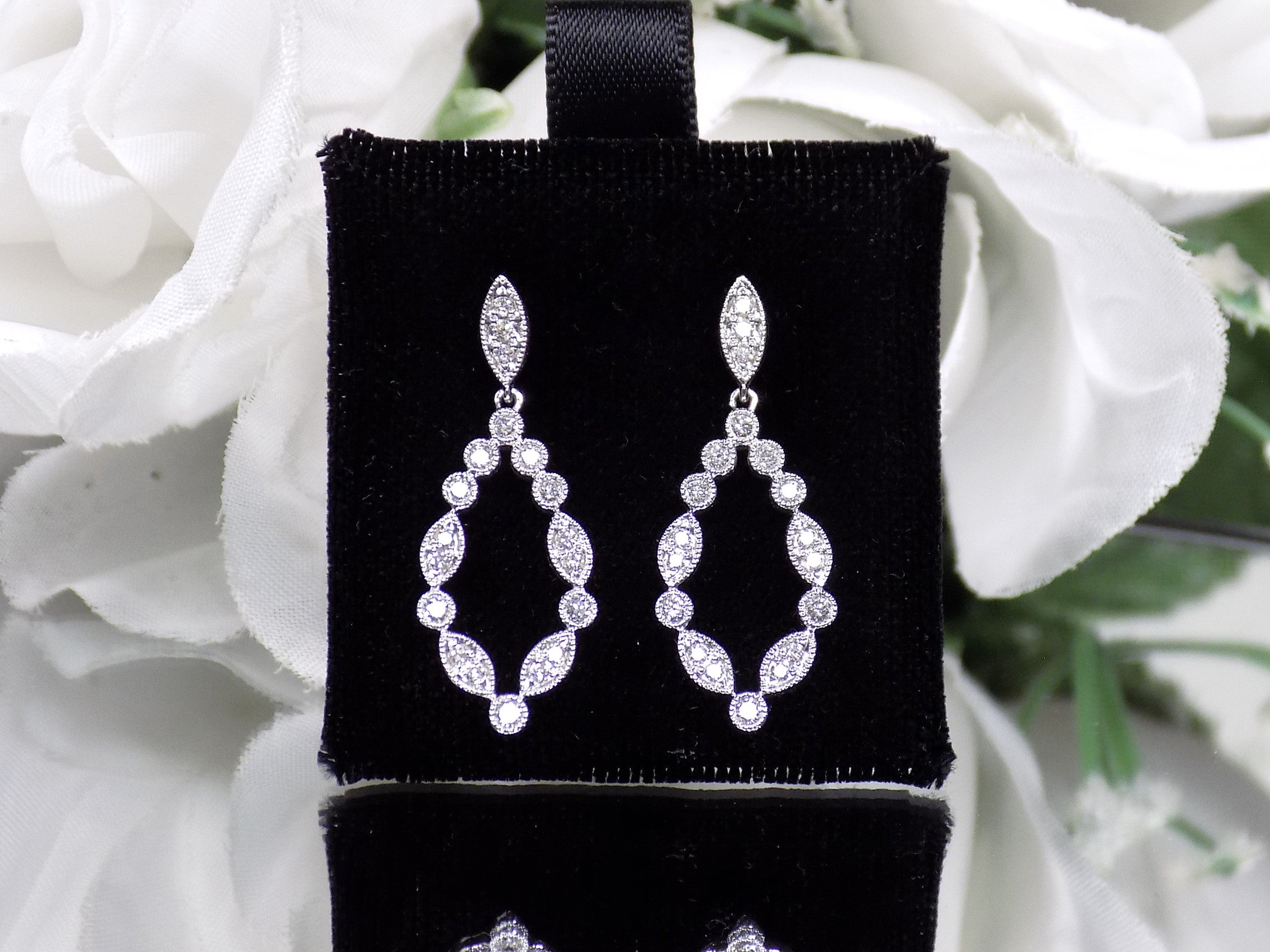 This is a pair of .50ct Natural Diamond Dangle Earrings in 14K White Gold.