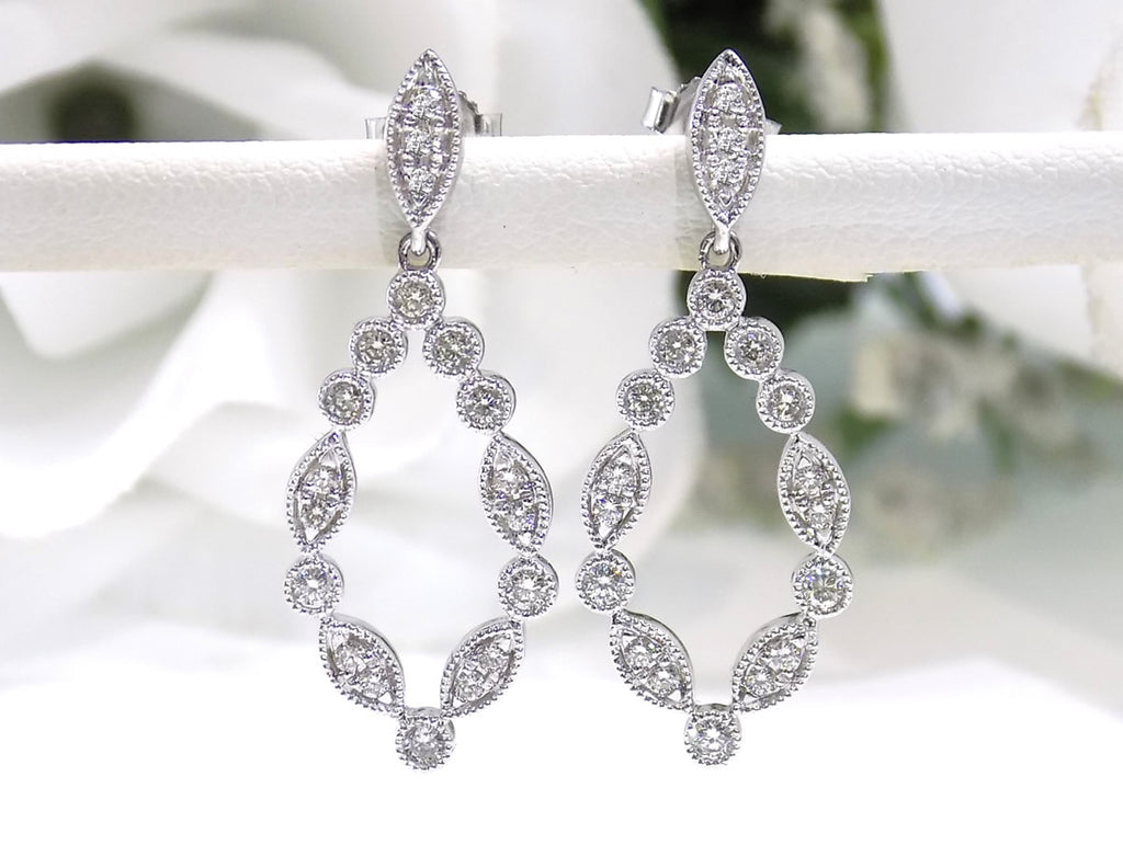 This is a pair of .50ct Natural Diamond Dangle Earrings in 14K White Gold.
