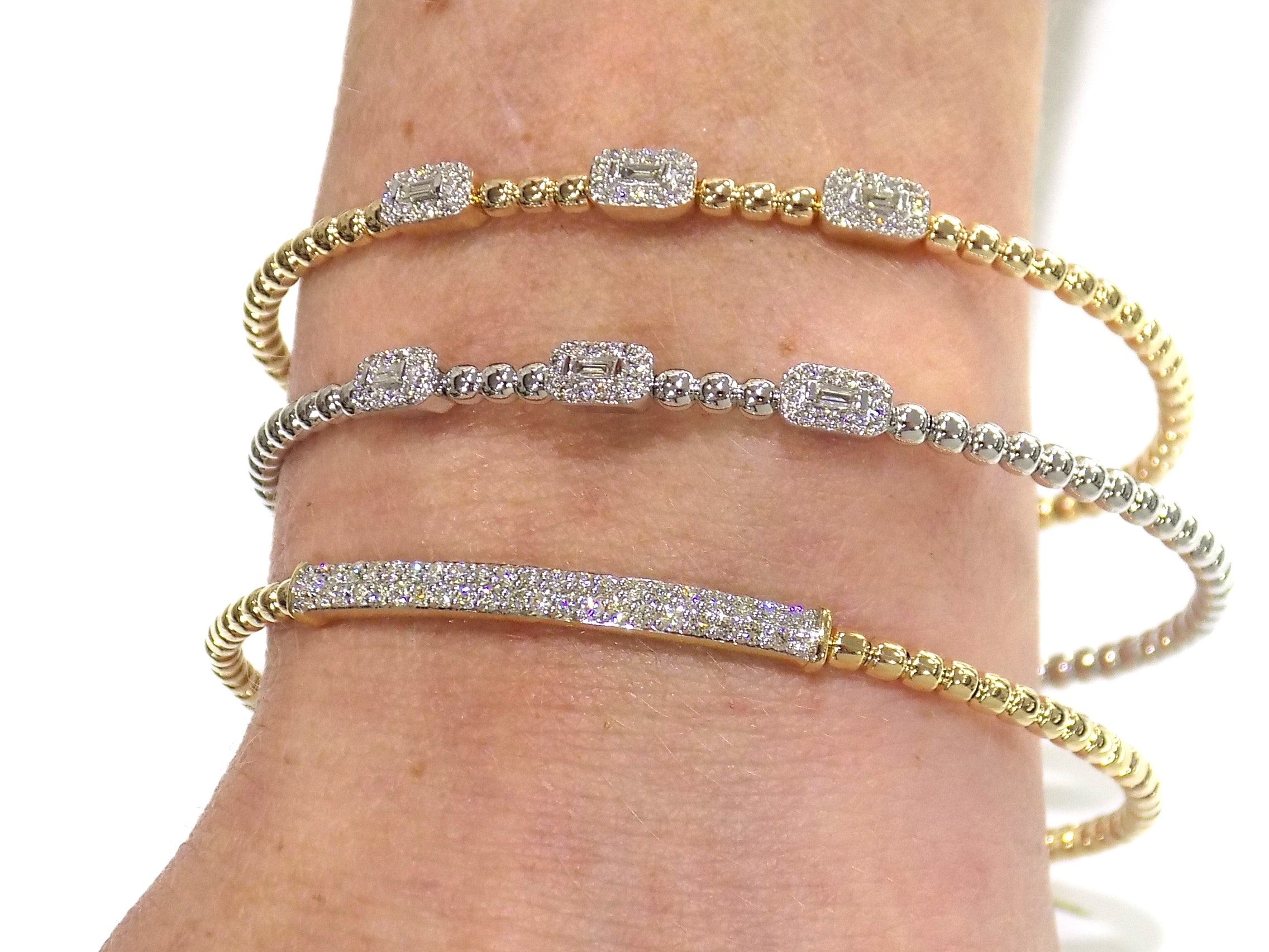 Natural diamond flex bracelets in 10K yellow or white gold.