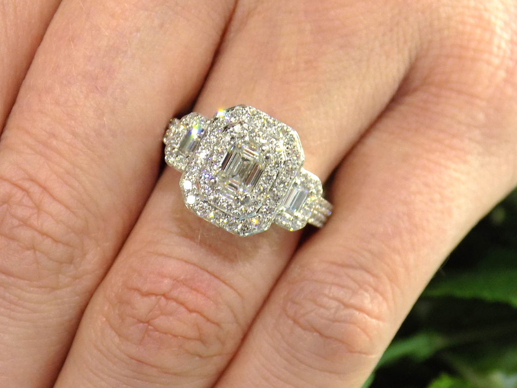 This is 1.56ct total weight natural emerald cut and round diamond ring in platinum shown on a woman's finger.
