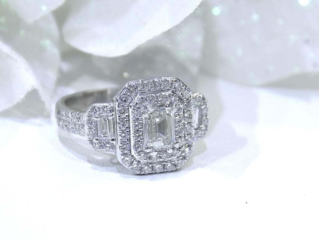 This is 1.56ct total weight natural emerald cut and round diamond ring in platinum shown with a white background.