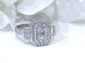 This is 1.56ct total weight natural emerald cut and round diamond ring in platinum shown with a white background.