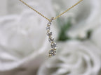 This is a vintage natural diamond journey style necklace in yellow gold.