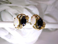 This is a pair of genuine opal and black onyx earrings in yellow gold shown on white background.