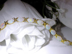This is a genuine opal tennis bracelet in yellow gold from our estate collection in like new condition on white background.
