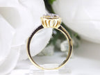 This is a .75ct total weight pear shape natural diamond cluster ring in two tone white and yellow gold side view.