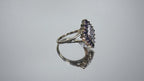 This is a video of a refurbished vintage genuine sapphire & diamond cluster ring in yellow gold shown turning slowly on mirrored background.