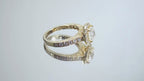 This is video of a halo style 2.17ct total weight natural round diamond ring with a 1.52ct center diamond in yellow gold shown turning slowly on a mirrored background.