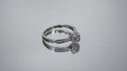 Video of a preowned small natural diamond ring in the halo design great for promise ring or inexpensive engagement ring.