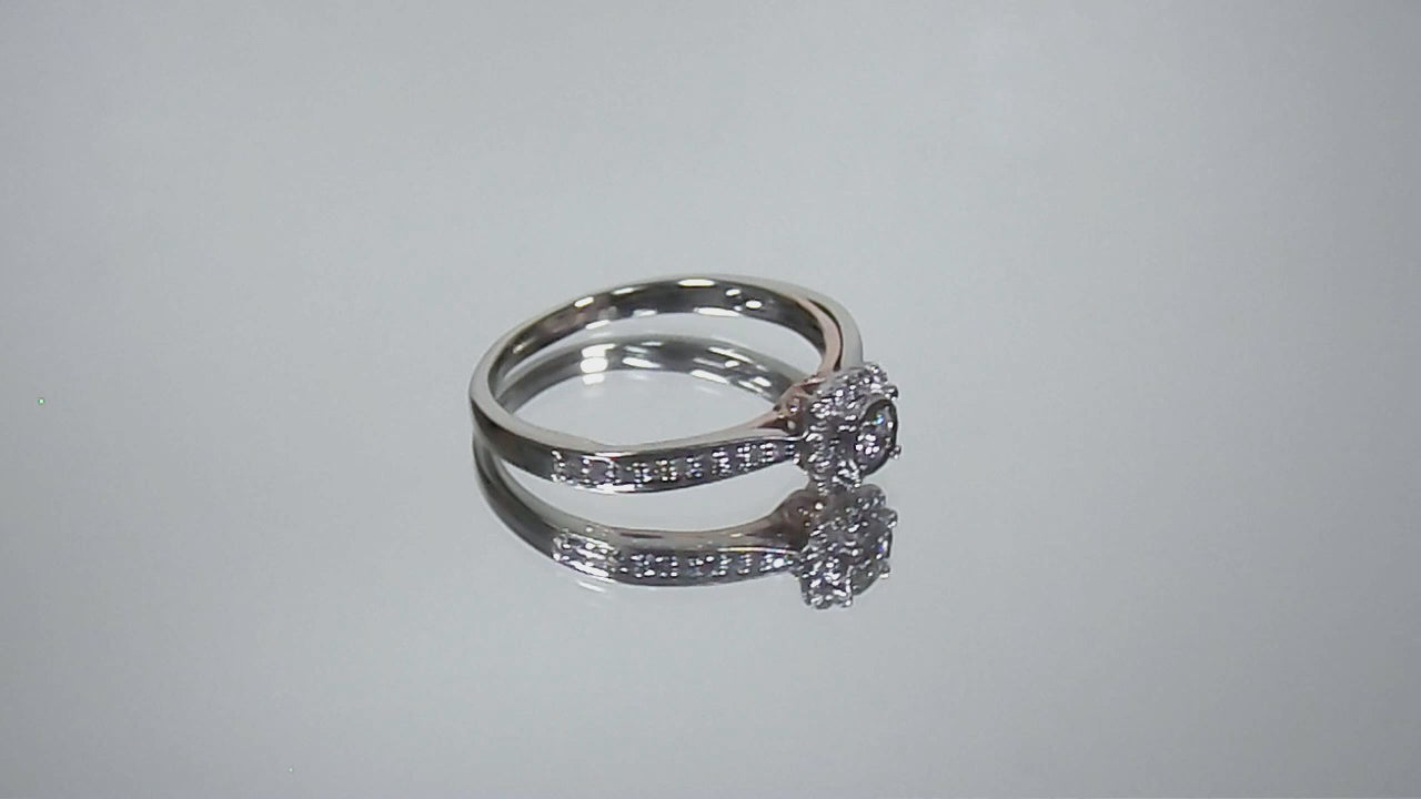 Video of a preowned small natural diamond ring in the halo design great for promise ring or inexpensive engagement ring.
