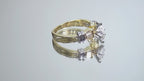 This is a a video of a .80ct total weight natural diamond ring baguette diamond accents in 2-tone 18K yellow gold and platinum shown rotating on a mirrored background.