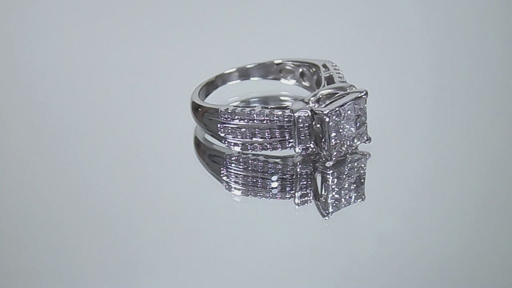 This is a video of a 1.00ct total weight natural diamond ring in white gold shown turning slowly on a mirrored background.