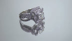 The is video of a 1.95ct total weight natural 2-piece natural round diamond wedding set with engagement ring and matching band already tacked together from our estate collection in white gold shown turning slowly on a mirrored background. 