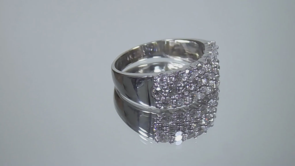 This is an estate 3-row 2.00ct total weight natural diamond band 8.2mm wide in 14K white gold on a mirrored surface rotating in a video.