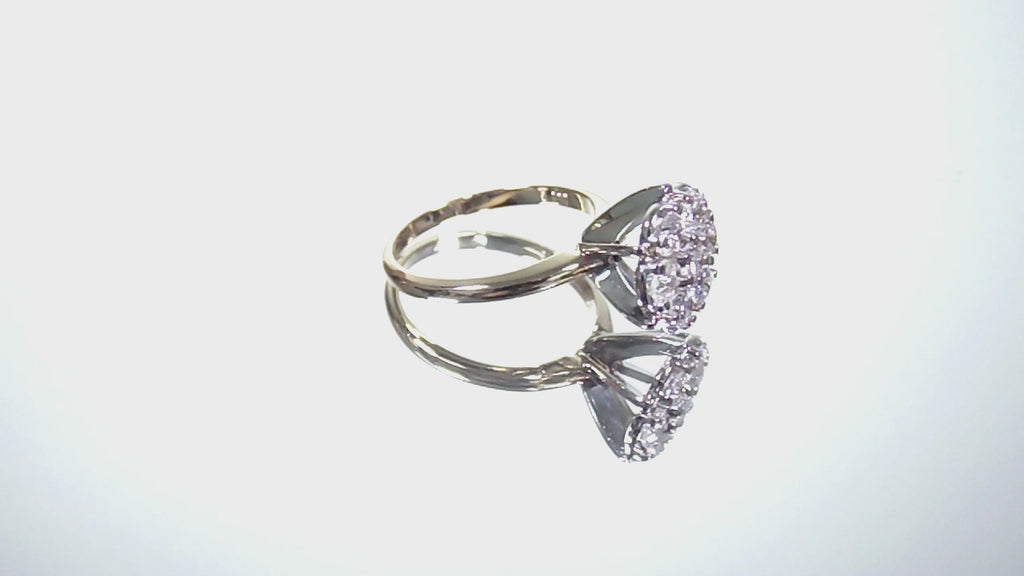Estate 1.00ct total weight 7 stone round natural diamond cluster in 14K Yellow and White Gold rotating on a white background.