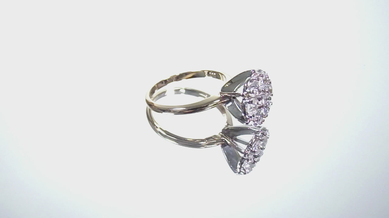 Estate 1.00ct total weight 7 stone round natural diamond cluster in 14K Yellow and White Gold rotating on a white background.