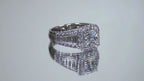 This is video of a 3.68ct total weight natural diamond ring with a 2.05ct natural princess cut set in a legendary designer Simon G white gold mounting shown rotating on mirrored background.