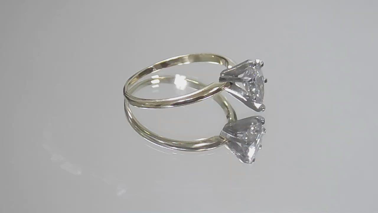This is a video of a high quality 1.00ct natural pear shape diamond solitaire ring in yellow gold shown rotating slowly on a mirrored background.