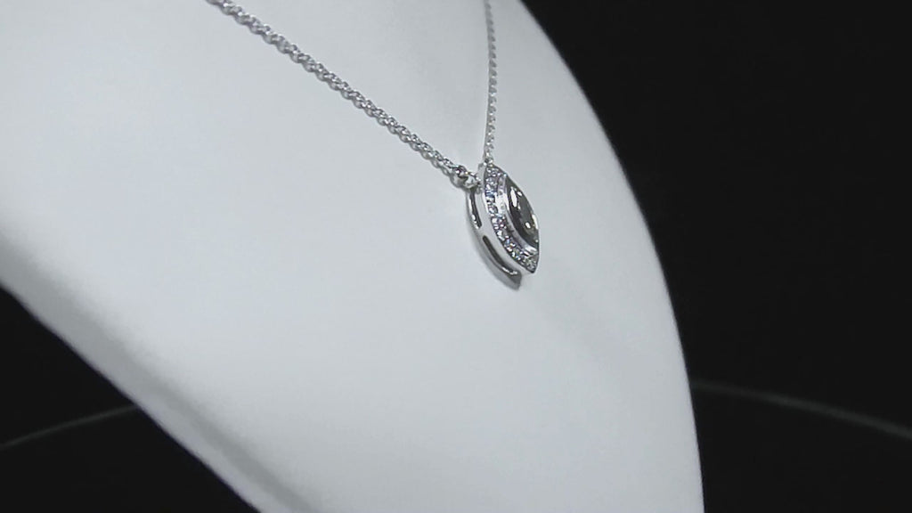 This is a .25ct natural center marquise diamond necklace with a halo of .10ct round diamonds in 14K white gold in a rotating video on a white display neck.