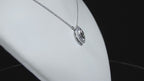 This is a .25ct natural center marquise diamond necklace with a halo of .10ct round diamonds in 14K white gold in a rotating video on a white display neck.
