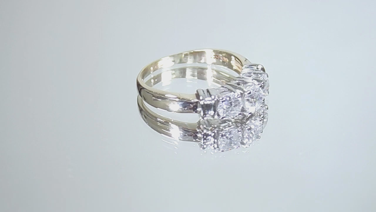 1.00ct total weight 3 stone natural diamond ring in 2 tone 14K yellow and white gold. Traditionally called a past, present, future ring rotating in a video on a white background.