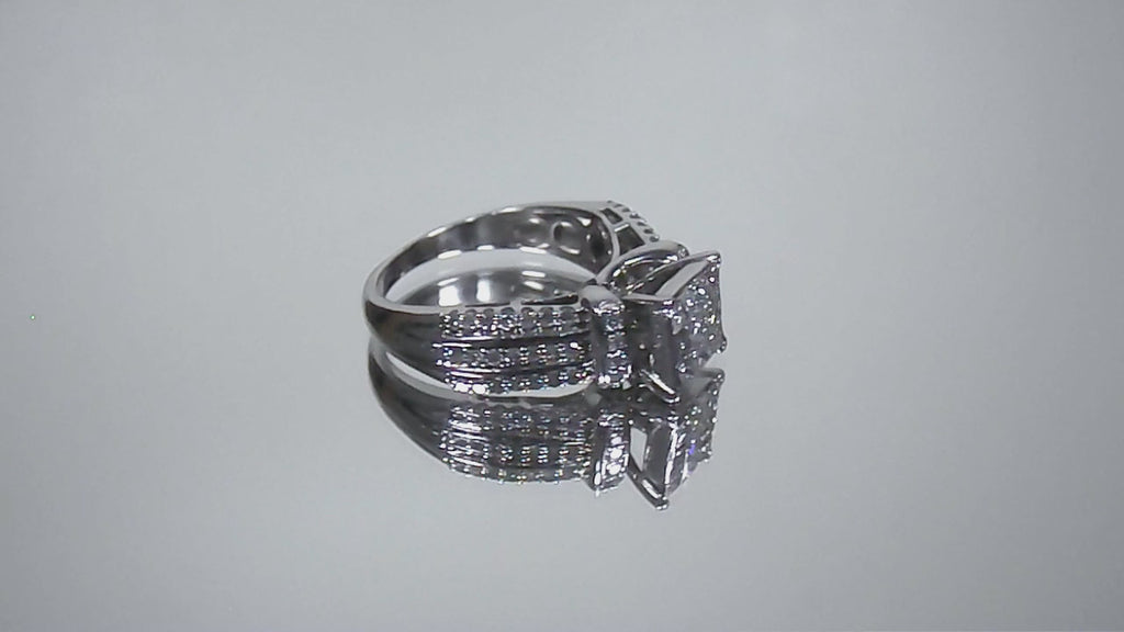 This is a video of an Estate ring with 1.00ct total weight invisible set diamond ring with natural princess cut and round diamonds in white gold.