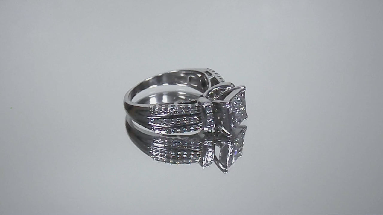 This is a video of an Estate ring with 1.00ct total weight invisible set diamond ring with natural princess cut and round diamonds in white gold.
