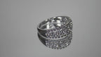 .20ct bezel set natural round brilliant diamond ring in 10K white gold rotating in a video on a mirrored background.