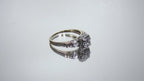 This is a video of a Vintage .59ct ladies natural diamond wedding ring in yellow gold turning slowly on mirrored background.