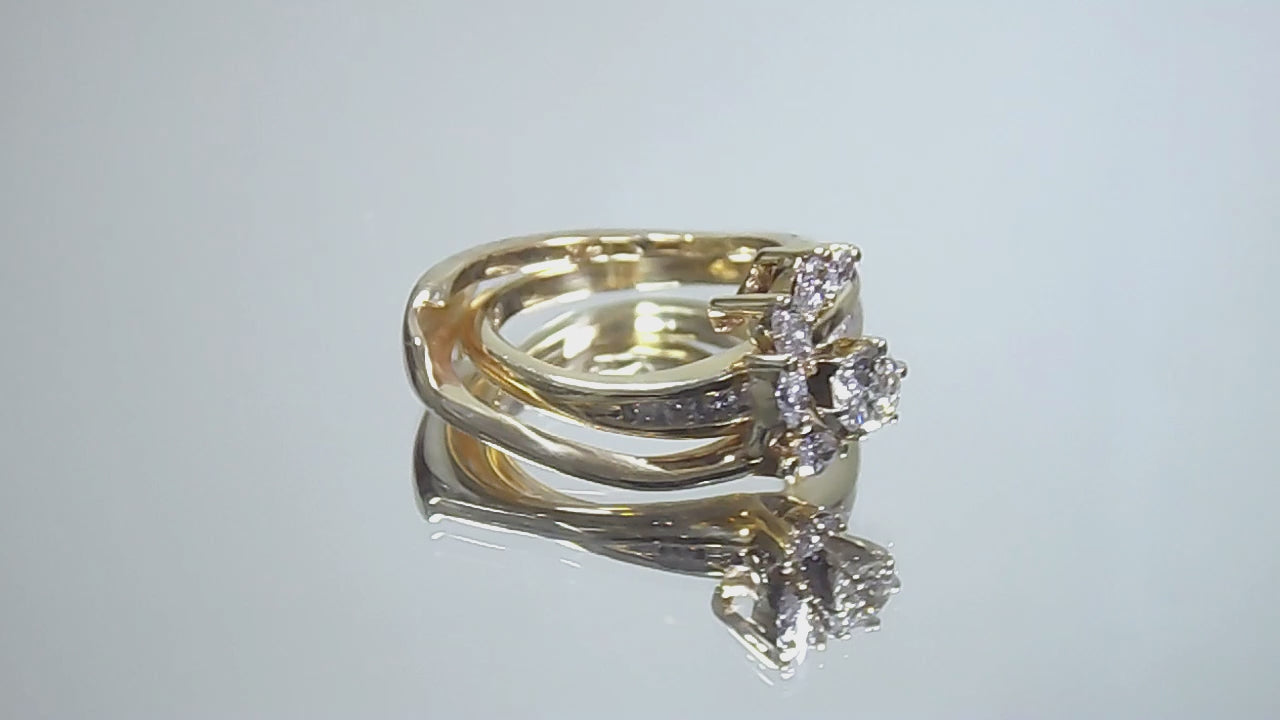 This is a custom 2-piece set with a matching band .77ct total weight with .25ct center round brilliant diamond in 14K yellow gold on a mirrored background rotating in a video.