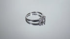 Video of a 3-Stone natural diamond ring in white gold turning on a mirrored background.