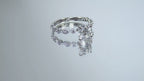 This is a video of a women's 1.72ct total weight natural round diamond engagement ring in white gold rotating with black mirrored background.