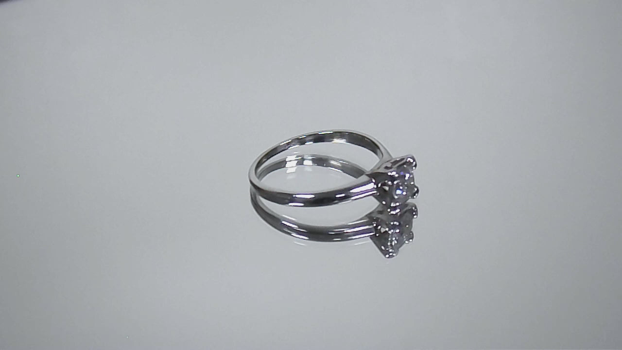 This is a video of an estate .45ct round diamond solitaire ring in white gold shown turning slowly on a mirrored background.