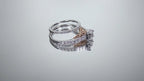 This is a video of halo style women's 2-piece wedding set including the engagement ring and matching band with princess cut center weighing .88ct total in white gold with rose accents shown rotating on mirrored background.