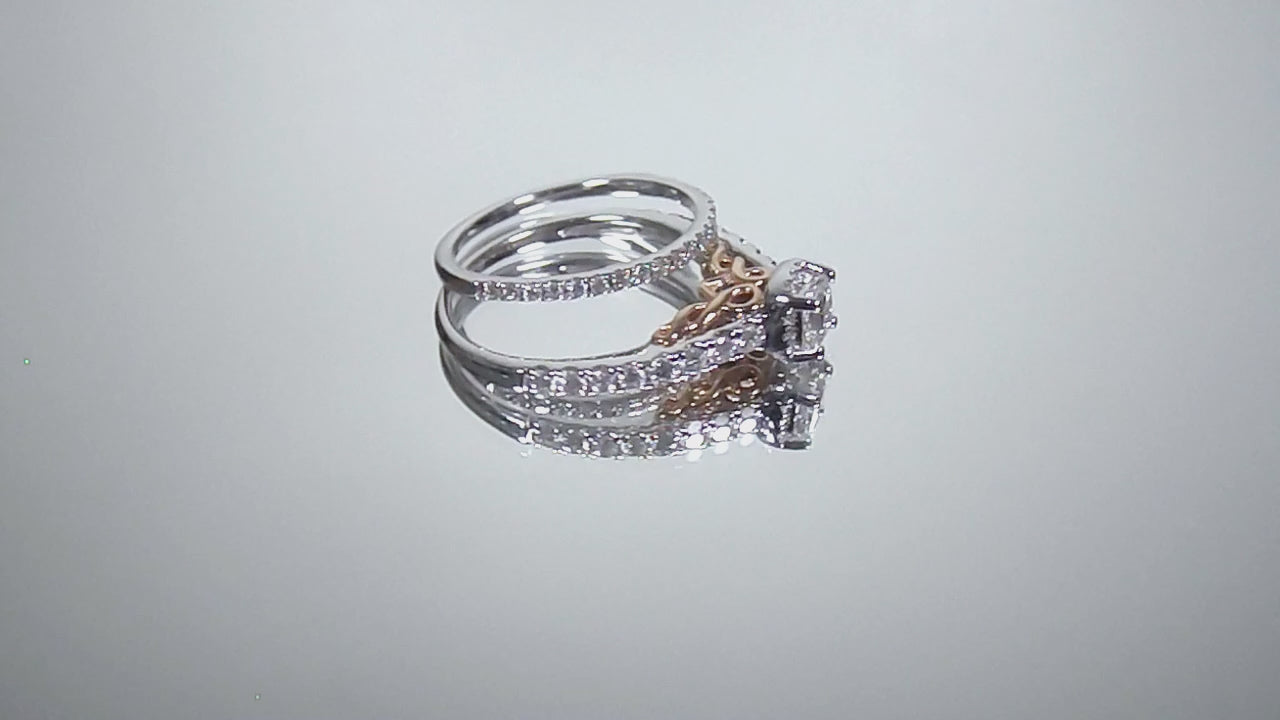 This is a video of halo style women's 2-piece wedding set including the engagement ring and matching band with princess cut center weighing .88ct total in white gold with rose accents shown rotating on mirrored background.