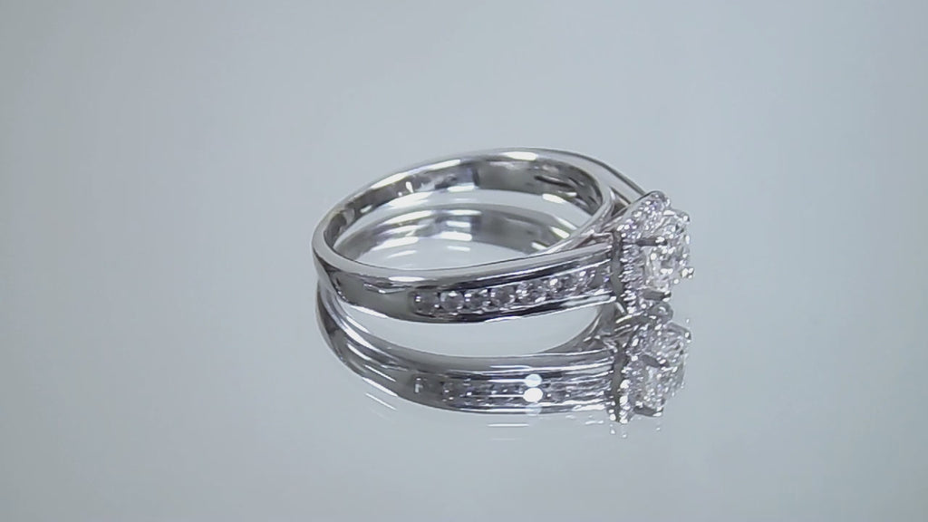 This is a video of a halo style .50ct total weight natural princess cut diamond ring in white gold turning slowly on a mirrored background.